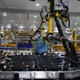 A worker assembles an electric car battery inside the battery pack shop at the electric automobile plant of VinFast in Haiphong on April 7, 2022.